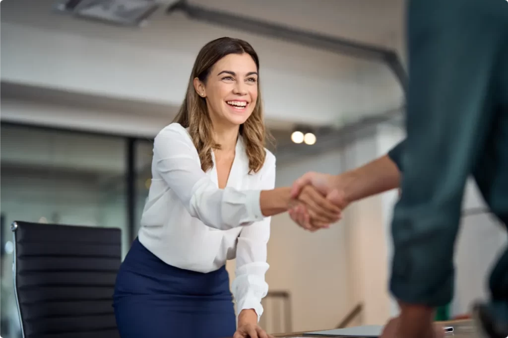 smiling lady shaking hands